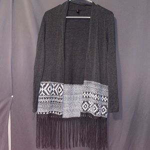 I am selling this cute cardigan. It is perfect for a cool day and is stylish!
